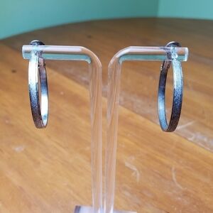 Earrings, flattened silver colored hoops, 1 inch